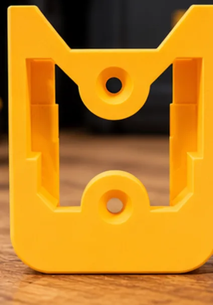 Yellow 3D-printed battery wall mount